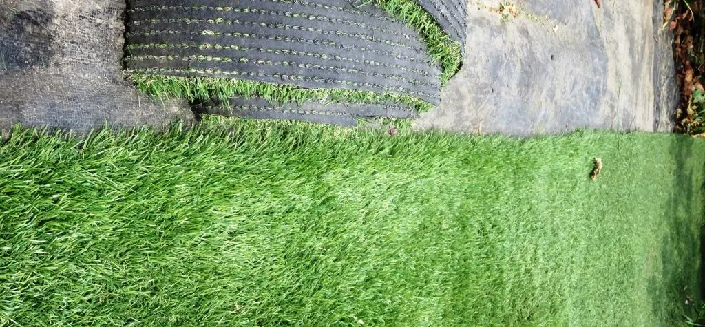 Beautiful garden with a well maintained artificial grass lawn